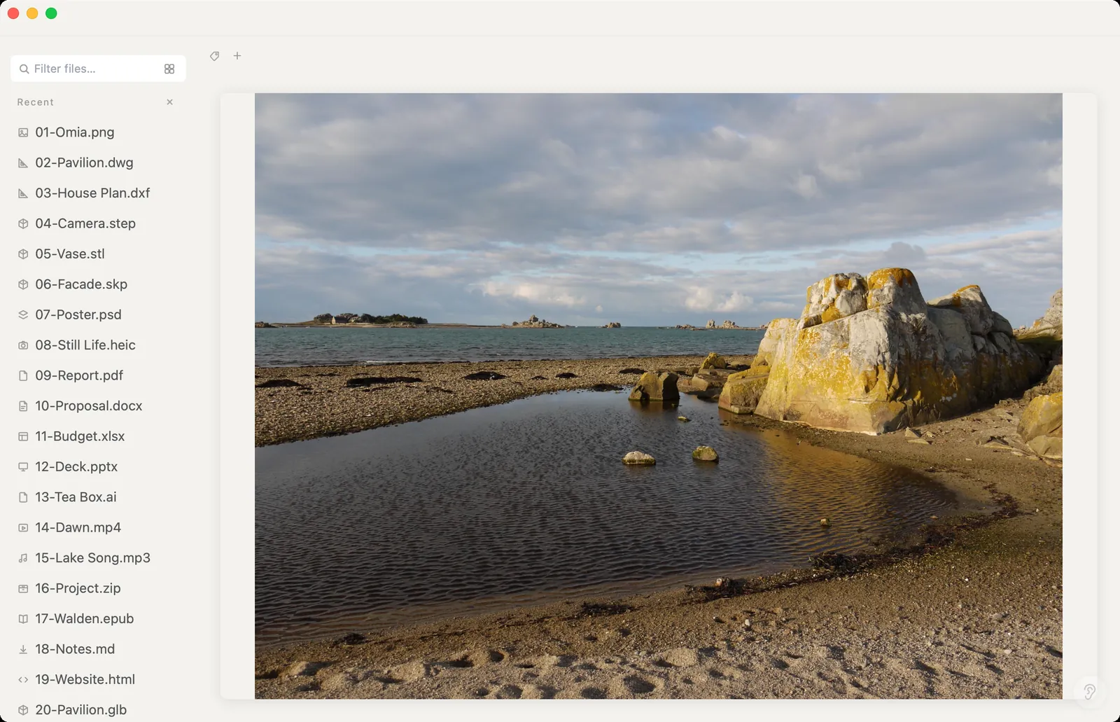 Camera RAW photo of a rocky shore previewed in Omia